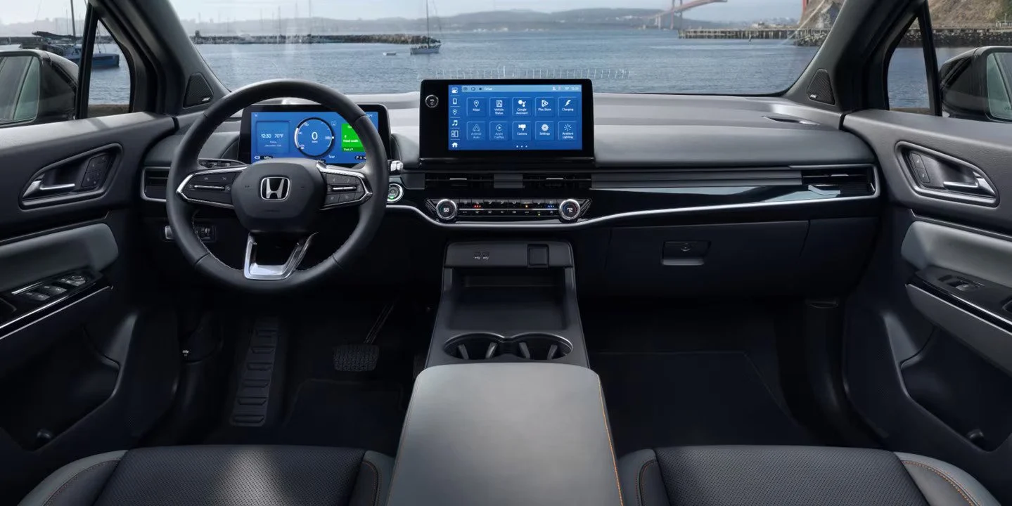 Honda Prologue EV 2026 interior showing digital instrument cluster, touchscreen infotainment system, steering wheel, and modern dashboard layout