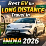 BYD Seal electric car on Indian highway with charging station and landmarks representing long distance EV travel in India 2026